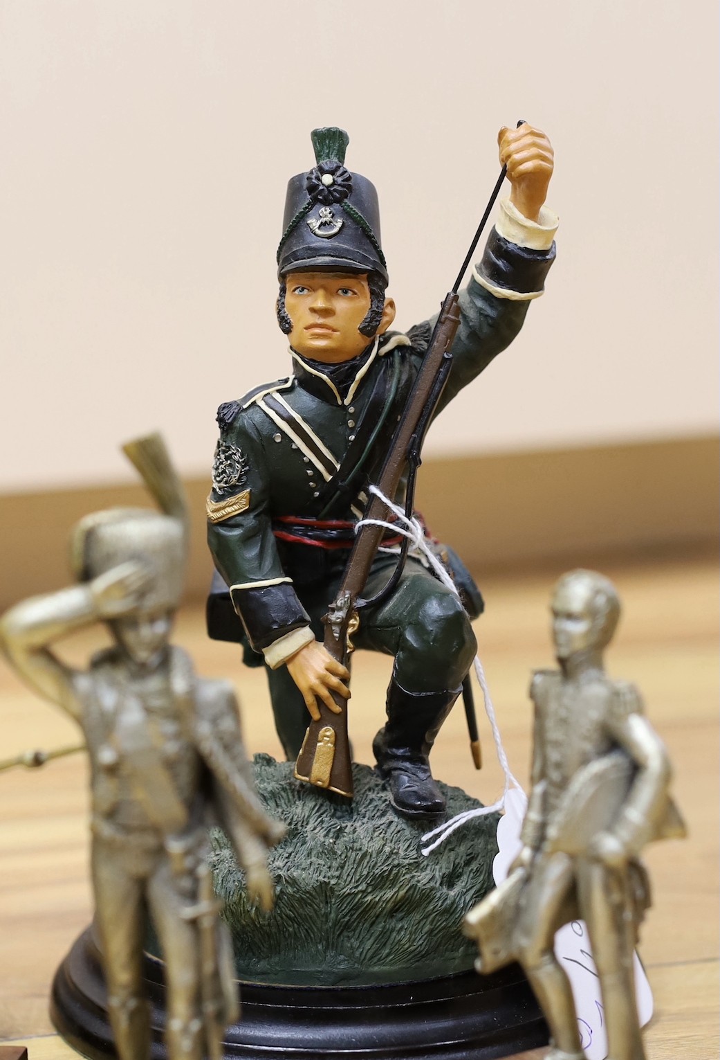 Duke of Wellington and Napoleonic war interest – a group of composition and ceramic figures of soldiers, a model of a cannon, a composition group of Wellington on horseback etc.